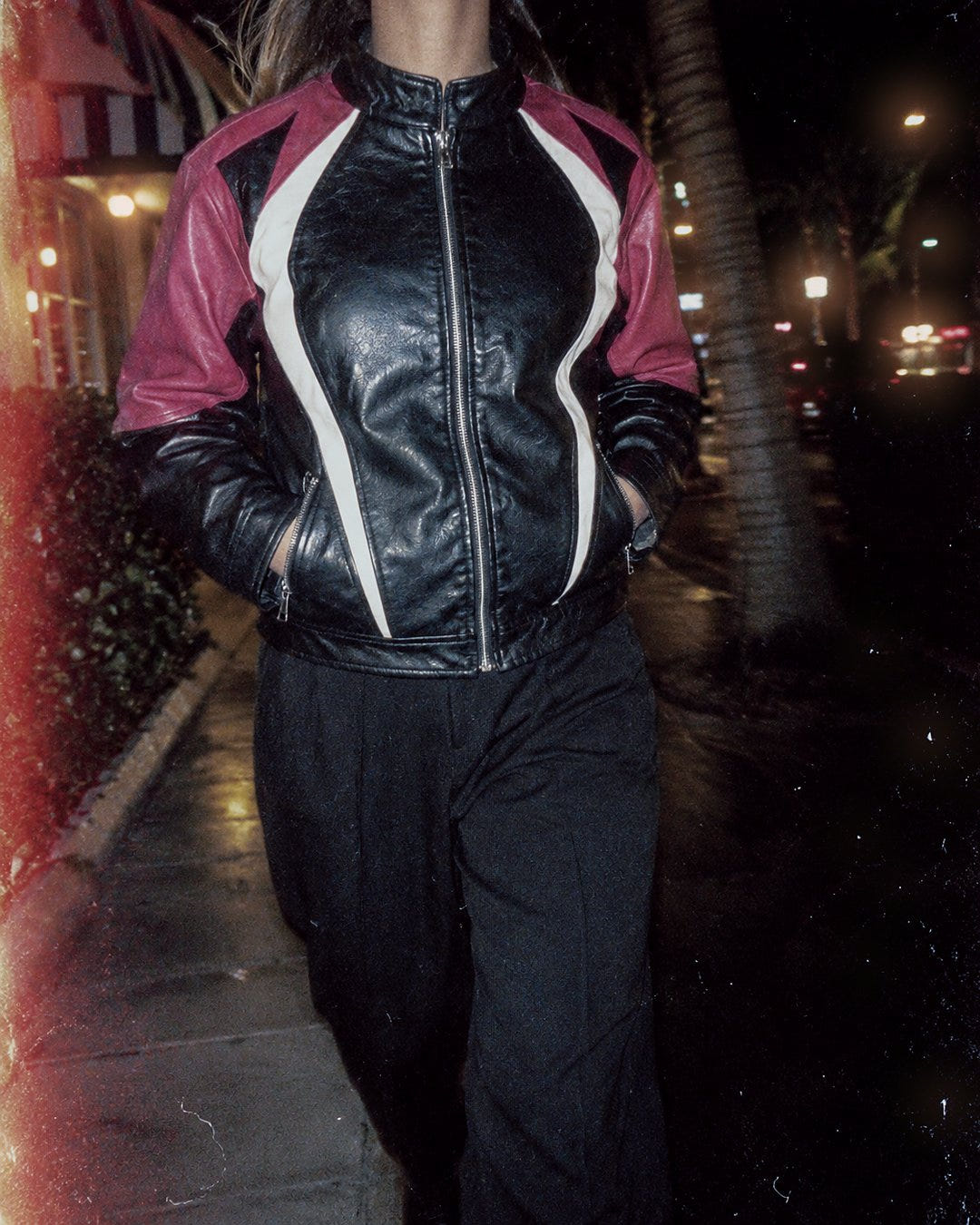 Pink Racer Jacket 1985 on a night walk past palm trees