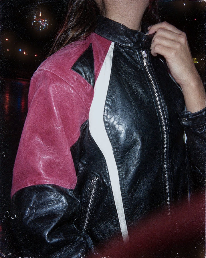 Close up of the pink shoulder panel and white piping on the Pink Racer Jacket 1985